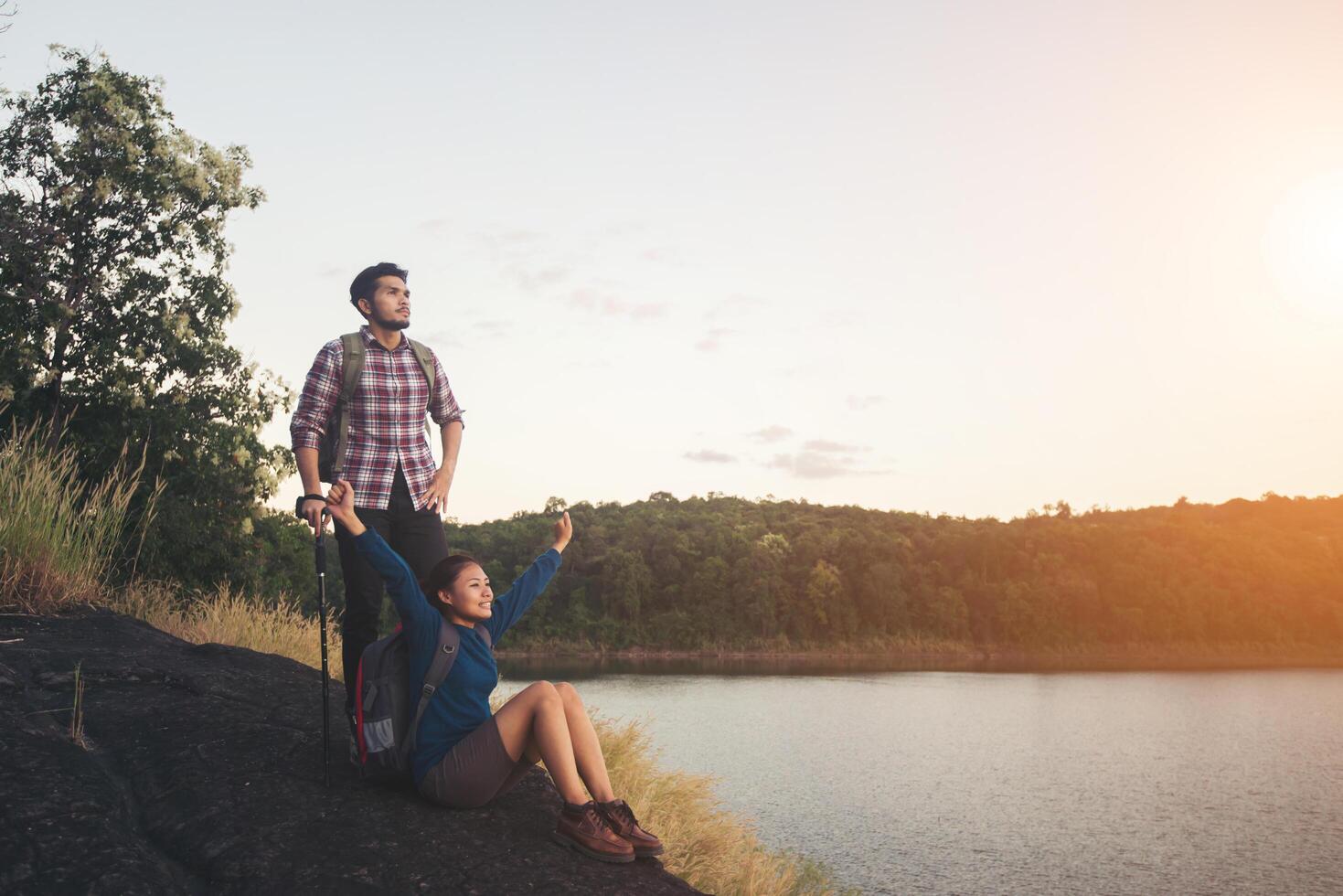 Having rest on the top of mountain below lake view during sunset. photo