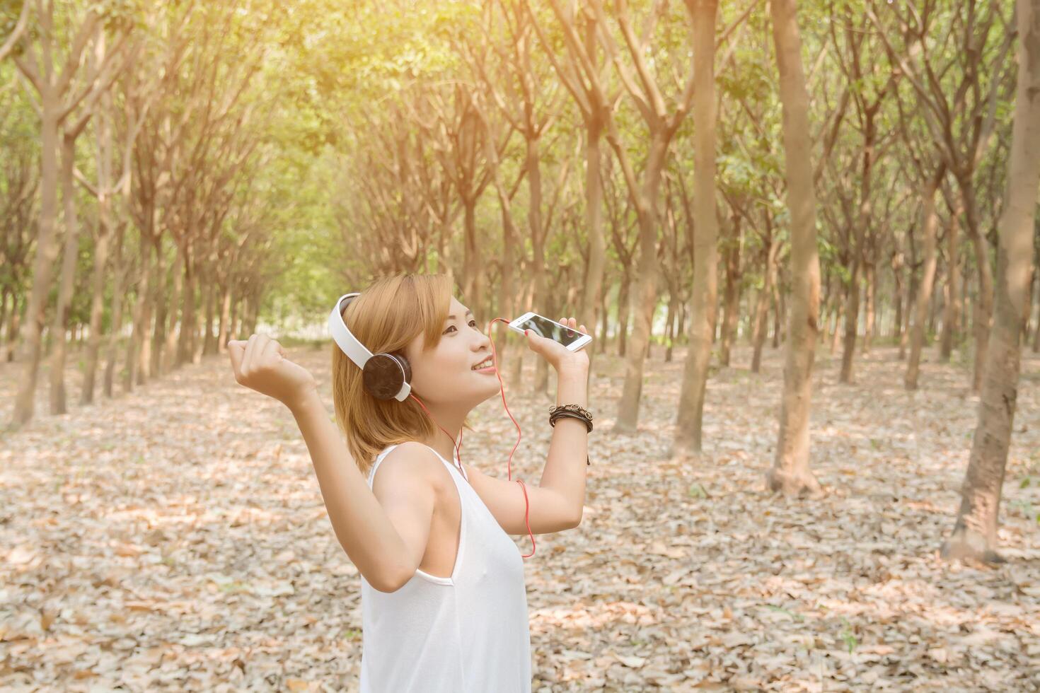 woman lifestyle concept. Young asian woman listening enjoying music. photo