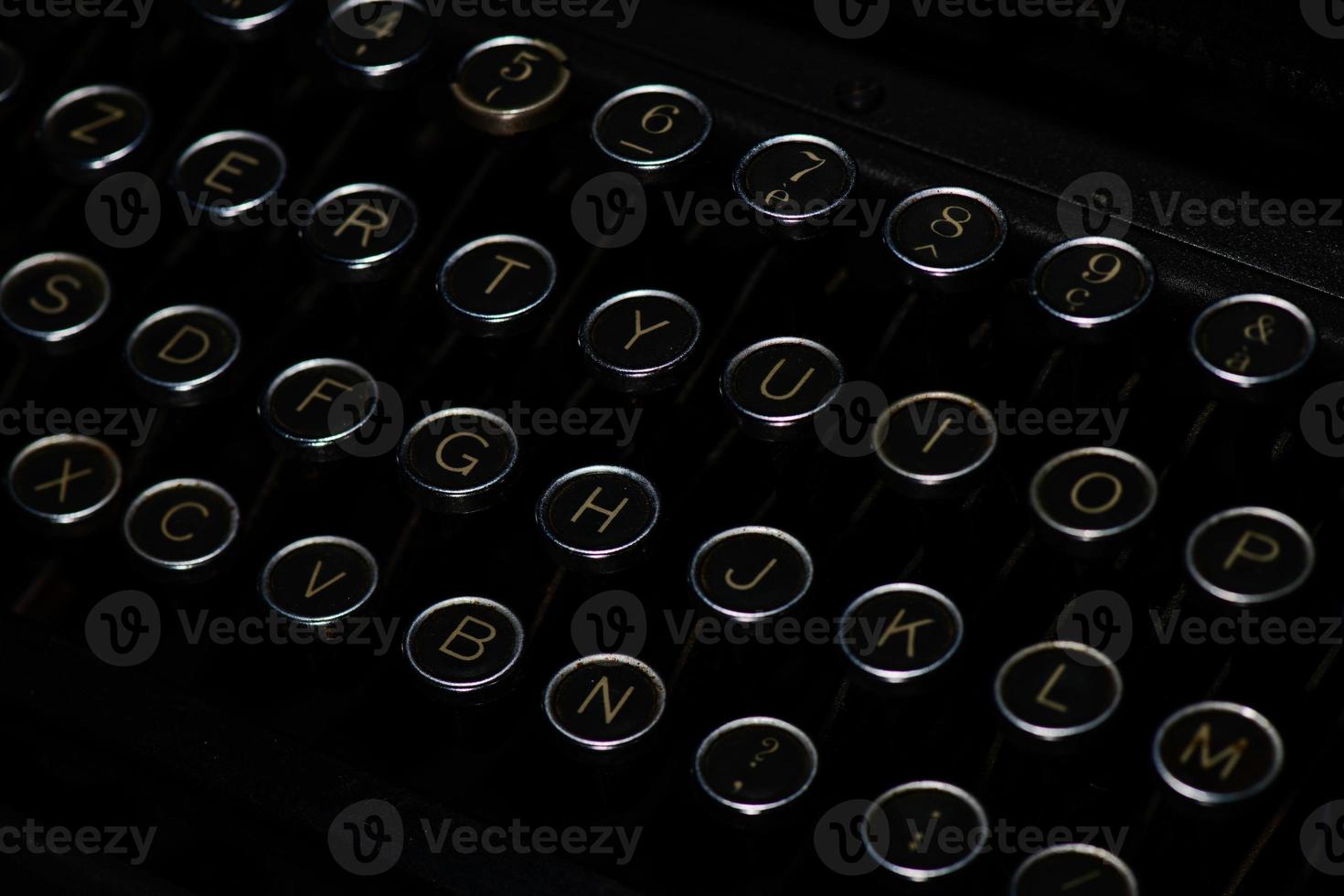 Keys with letters of ancient black typewriter photo