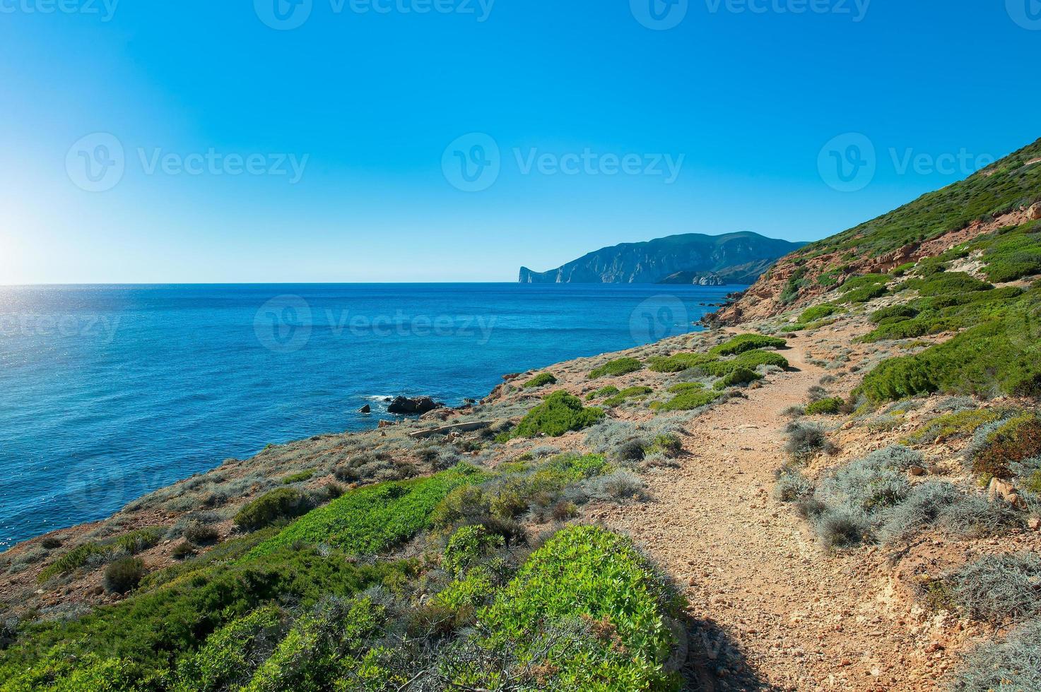 Island of Sardinia in Italy footpath on the sea photo