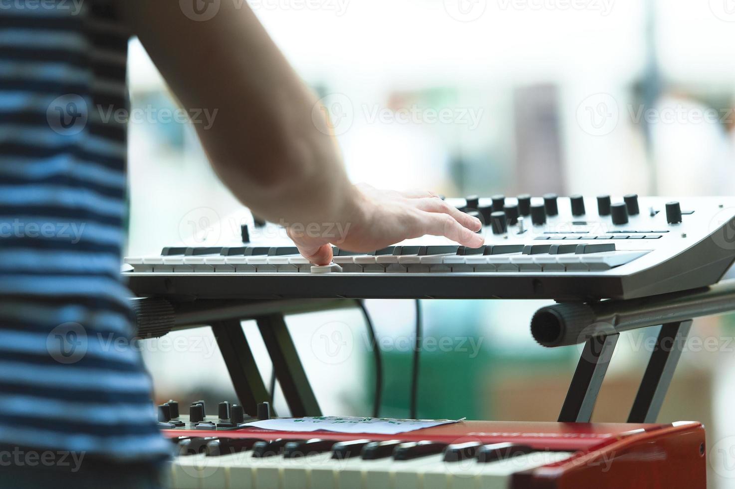 Keyboard player of a pop group during a show photo