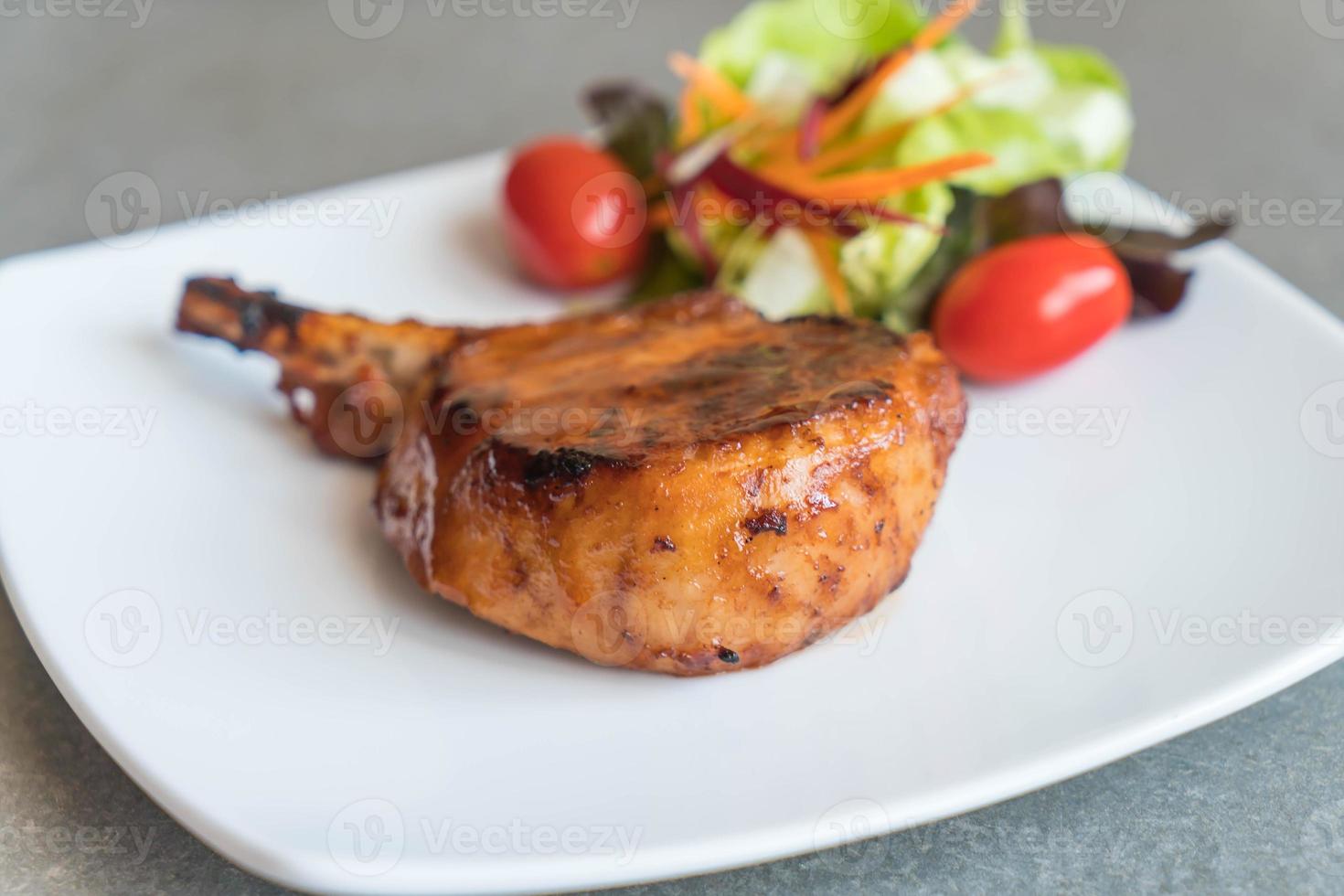 Pork chop steak on the table photo