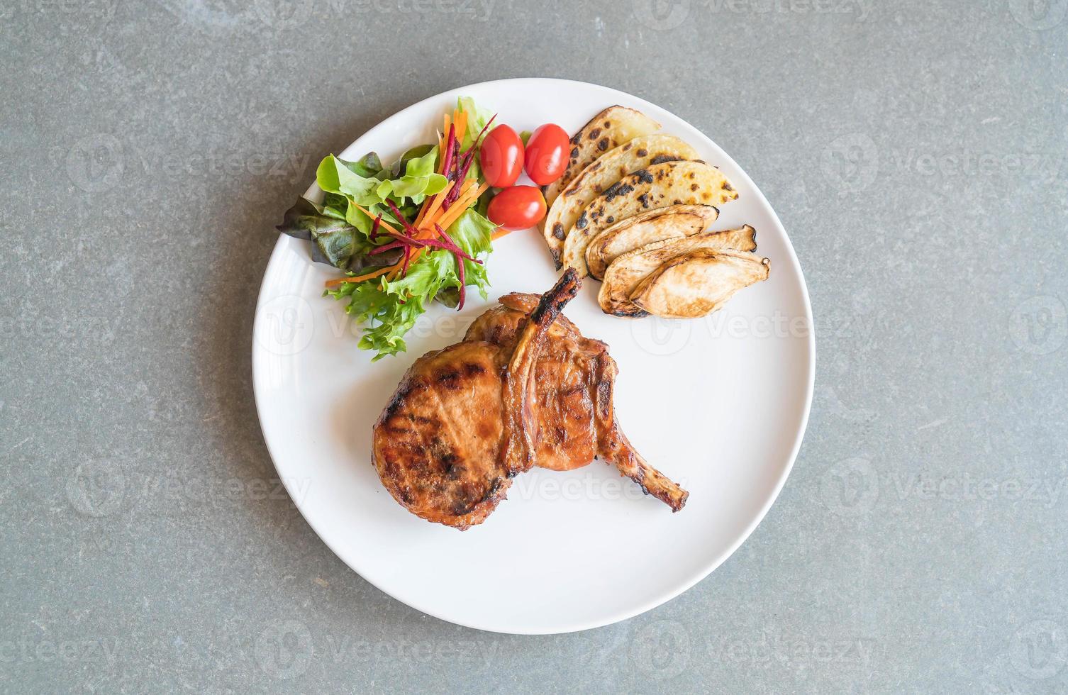 Pork chop steak on the table photo