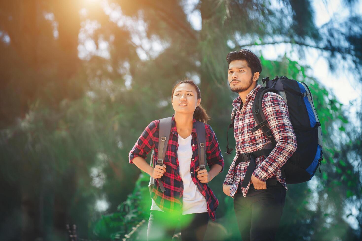 Young couple go adventure hiking together on vacation. photo