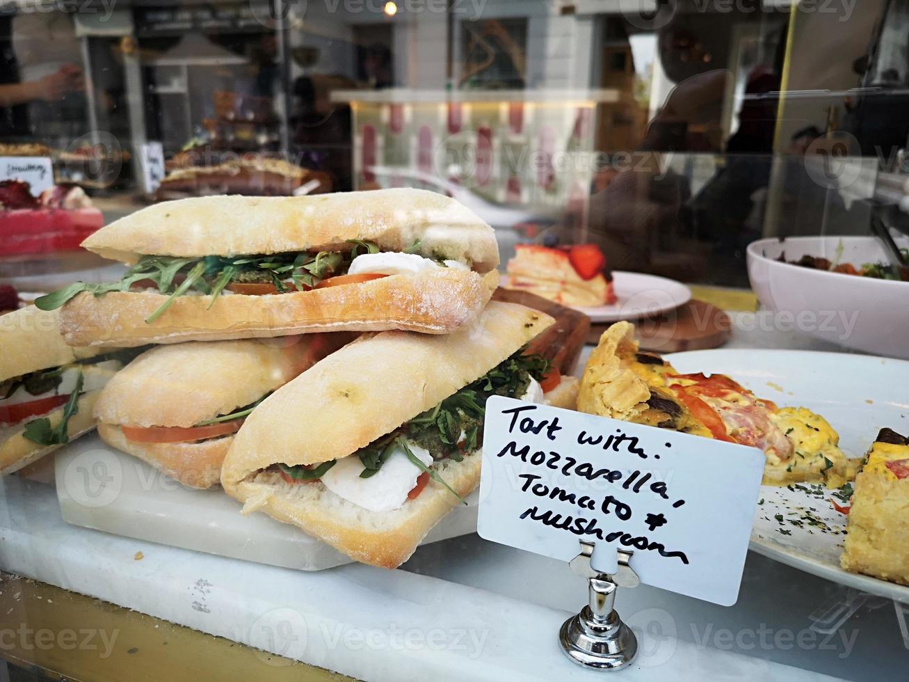 sandwich on a counter show window in Portobello Market, Notting Hill. photo