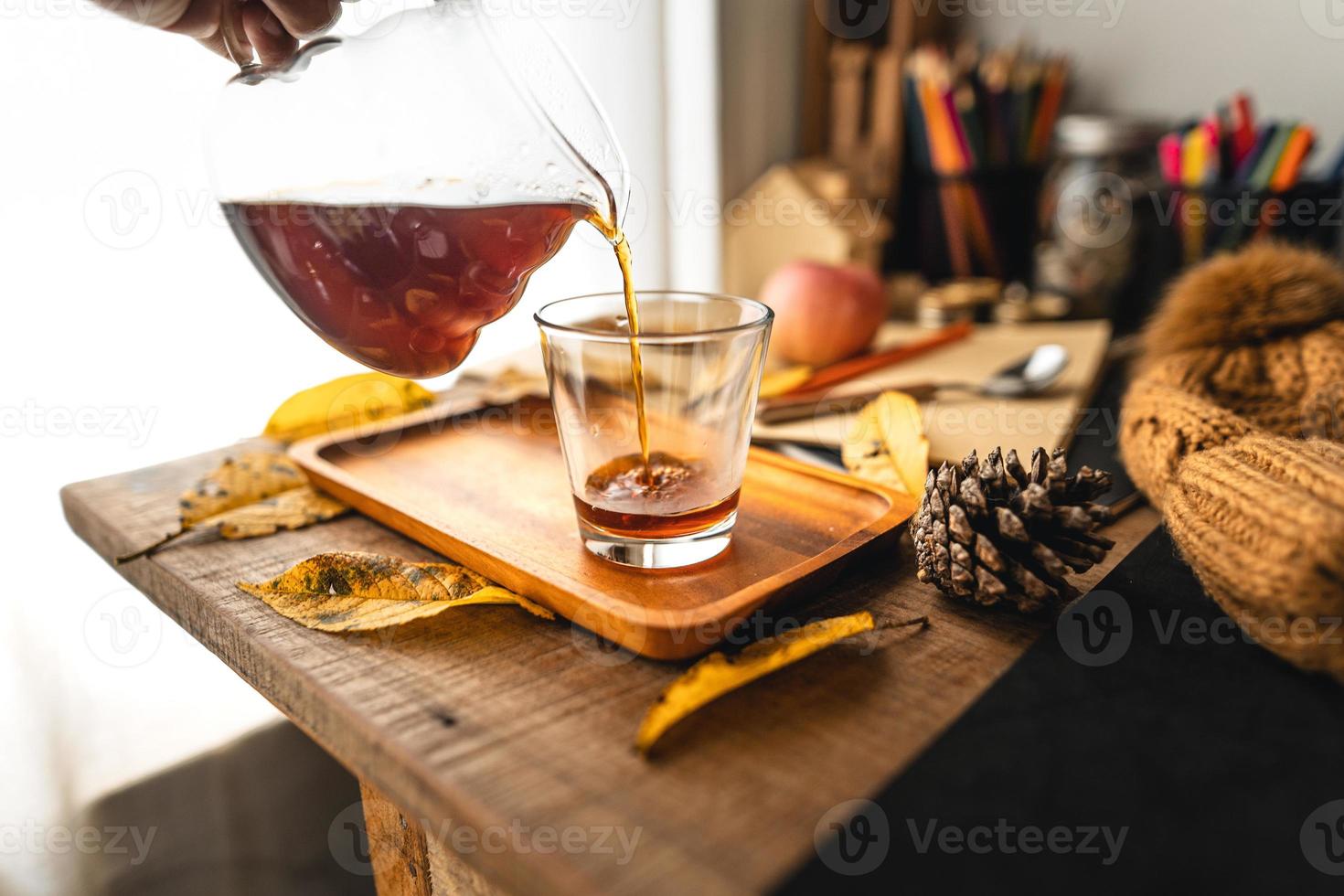 coffee in a mug on the desk in autumn photo