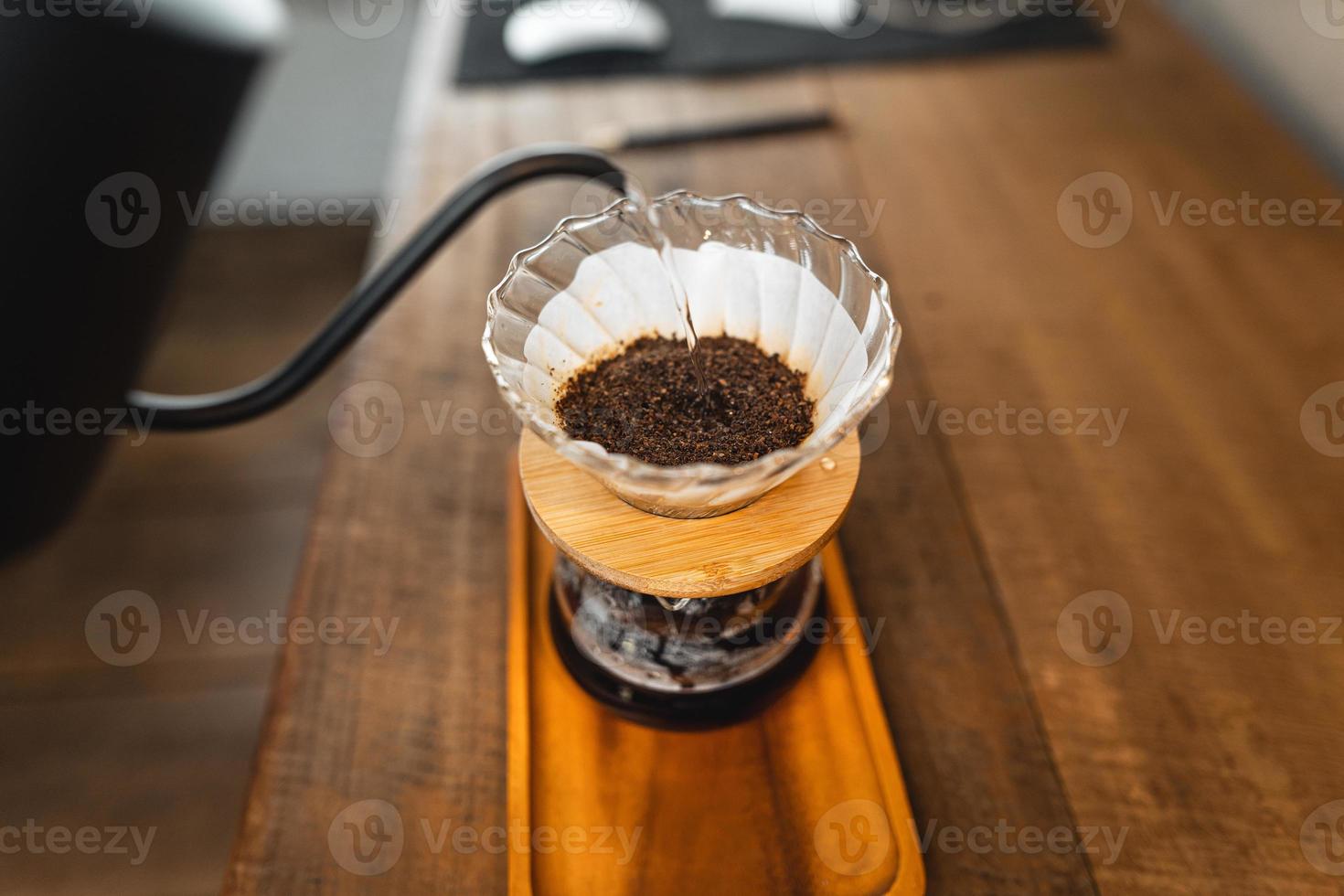 Pouring a hot water over a drip coffee photo