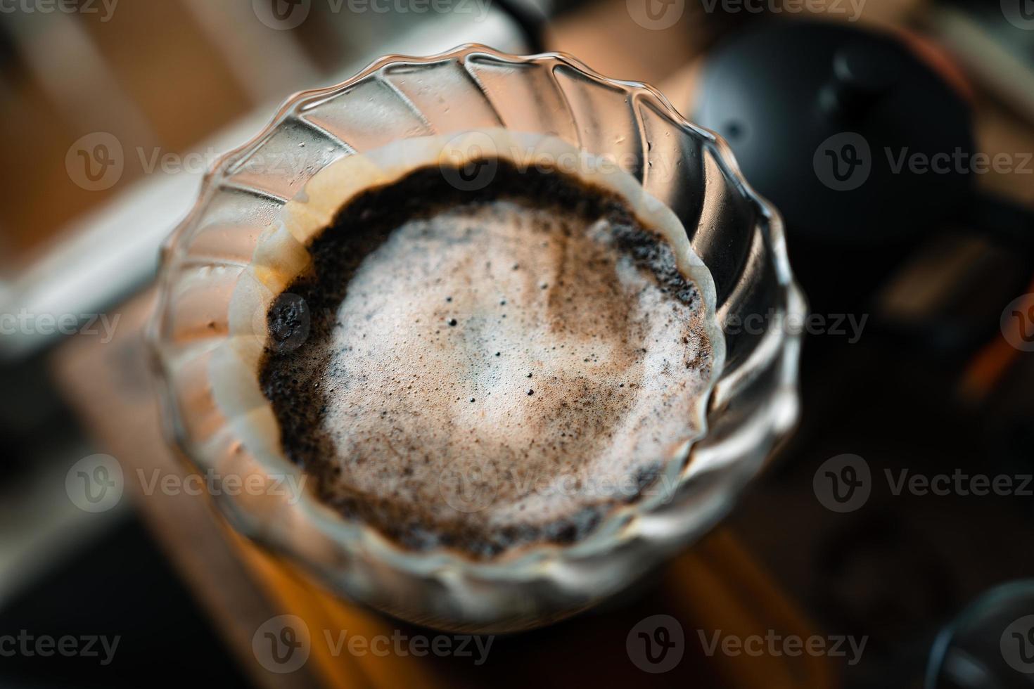 drip coffee in house,Pouring a hot water over a drip coffee photo