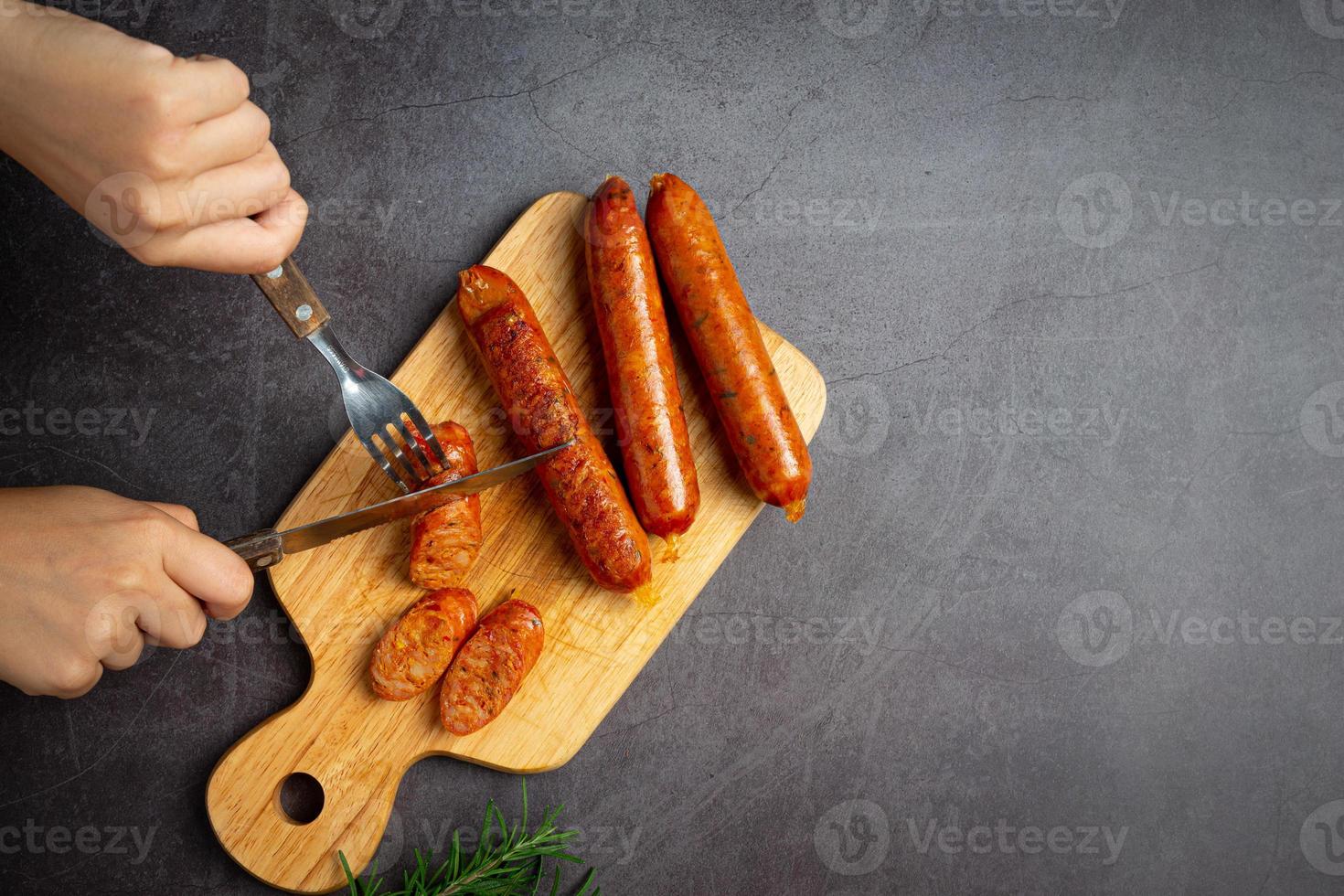 Sausages fried with spices and herbs photo