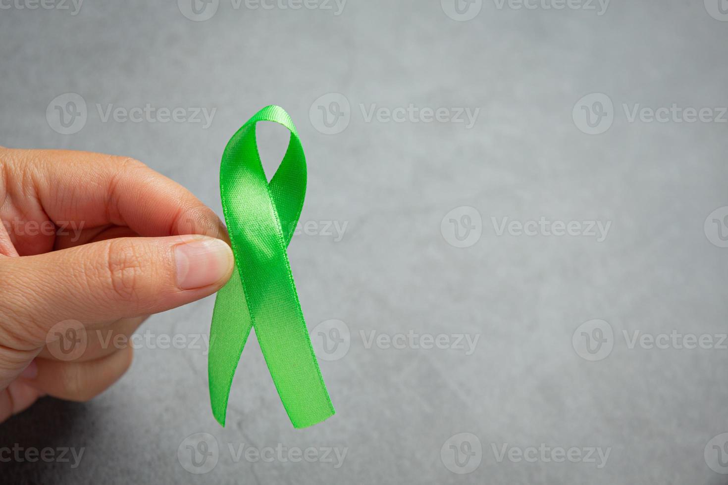 Green ribbon. Glaucoma awareness month photo