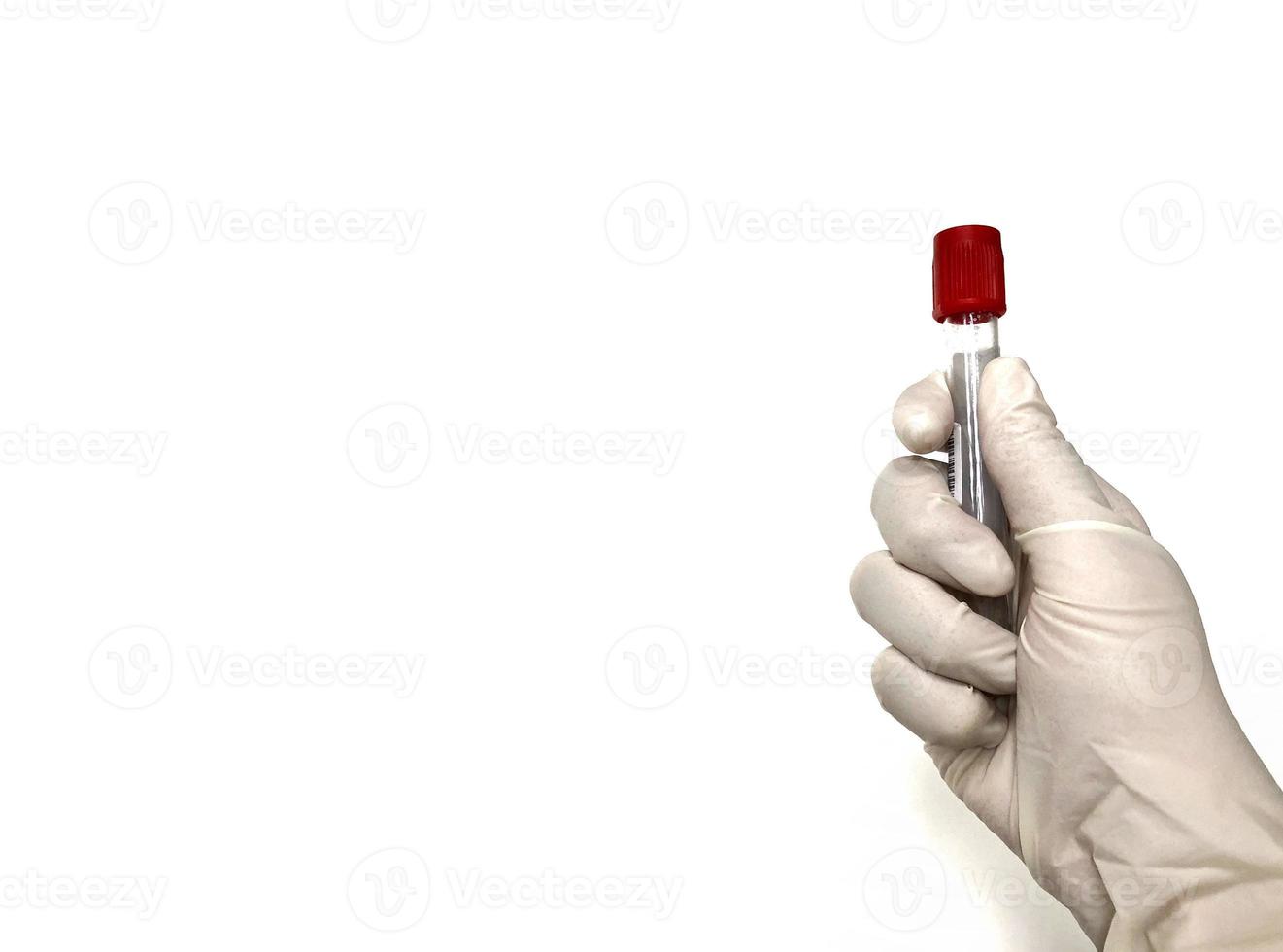 Hand wearing glove holding blood test tube on white background photo