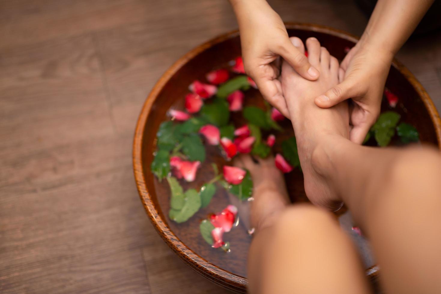 Top View  shot of a woman feet dipped in water photo