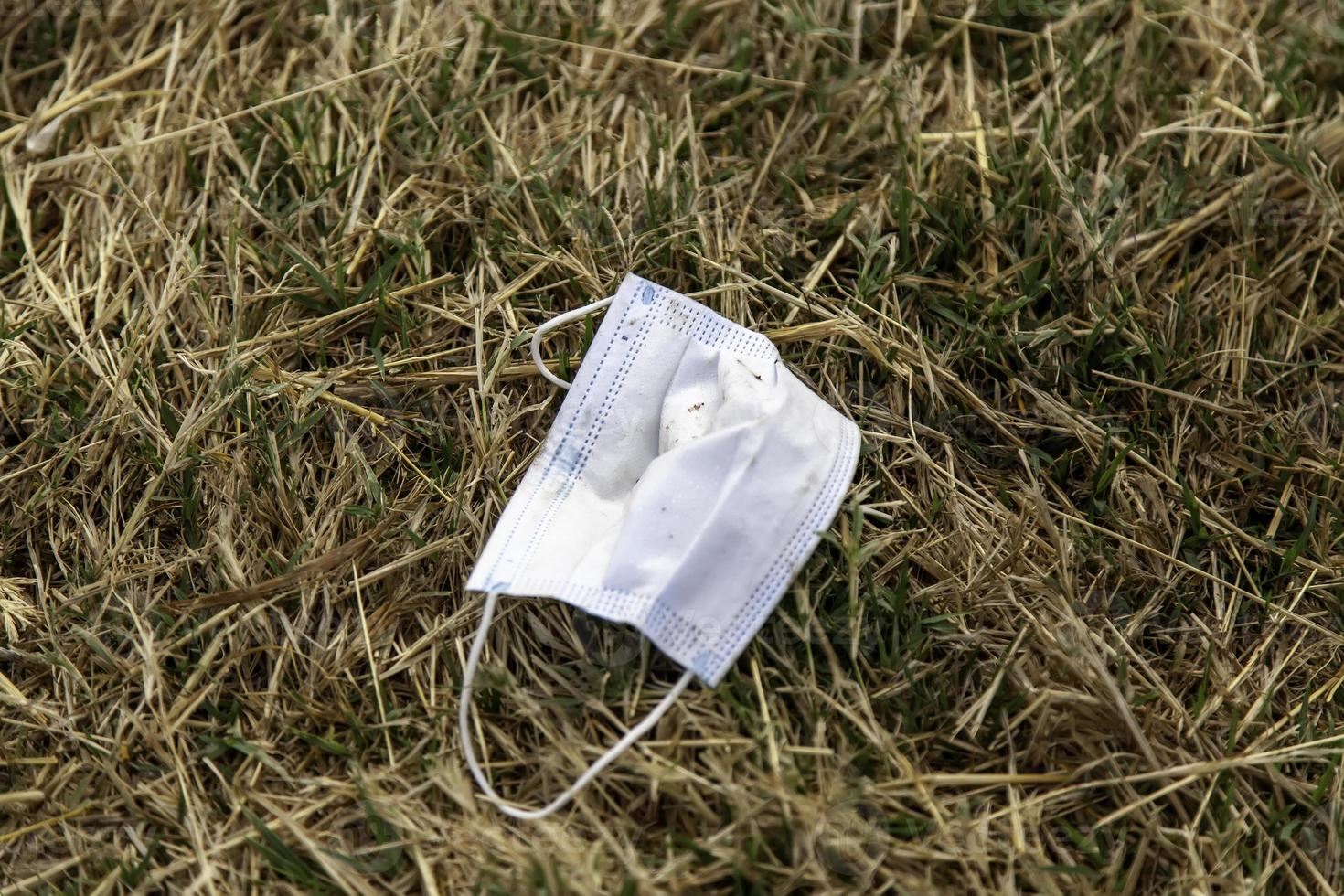 Mask thrown in the field 3096477 Stock Photo at Vecteezy