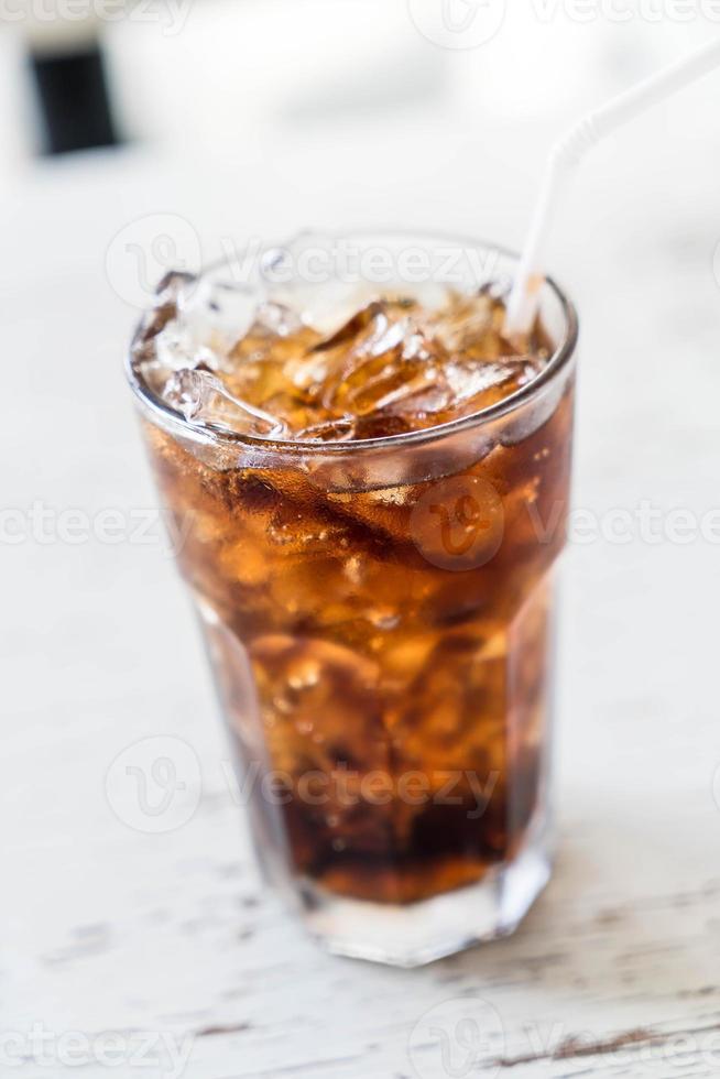 Iced cola glass on the table photo