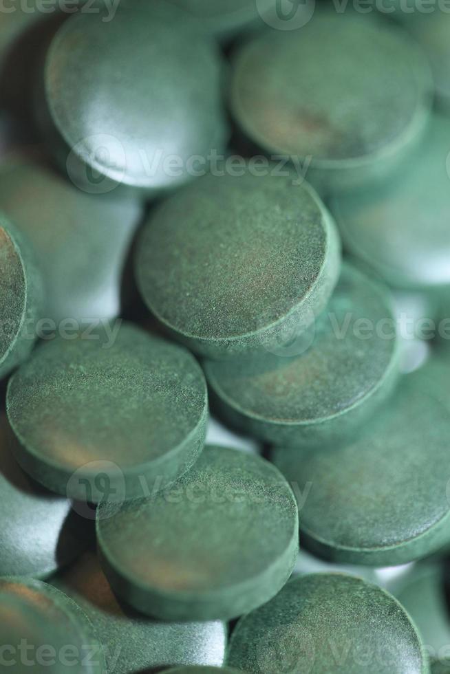 Pastillas de cerca médica espirulina platensis familia de algas algaespace foto