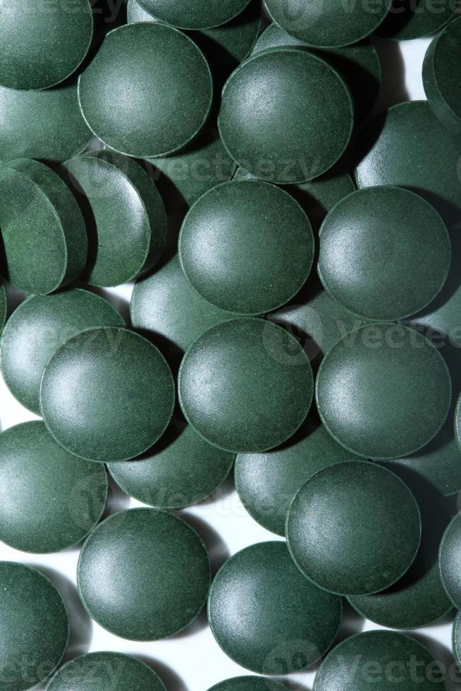 Pastillas de cerca médica espirulina platensis familia de algas algaespace foto