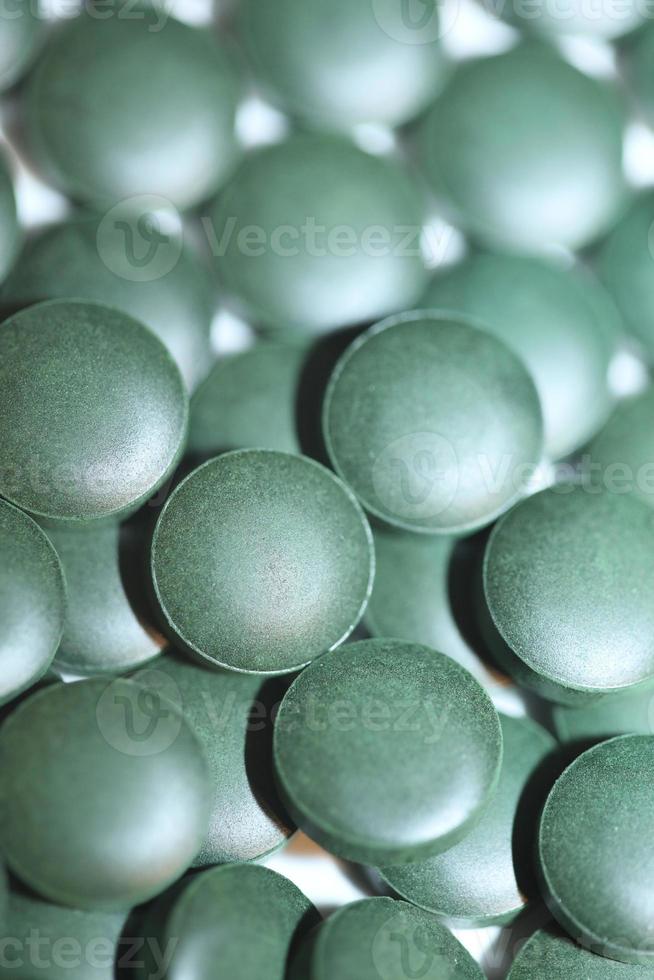 Pastillas de cerca médica espirulina platensis familia de algas algaespace foto