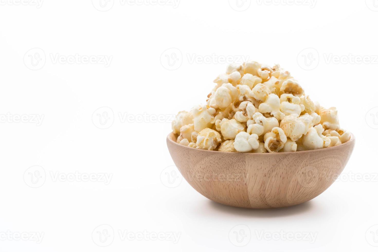 Caramel popcorn on white background photo