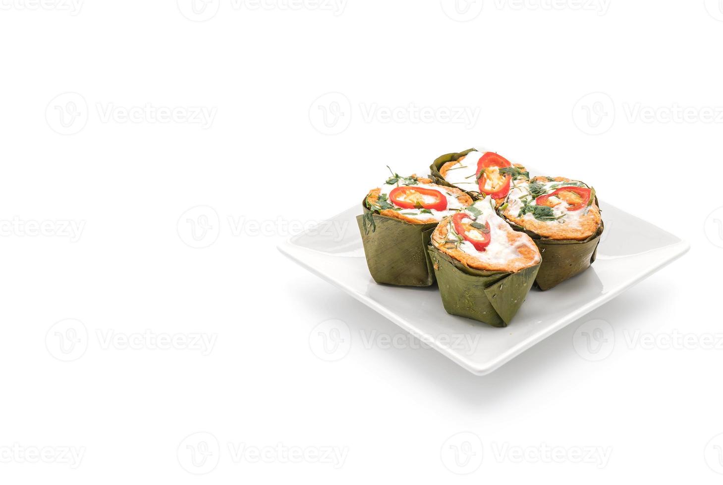 Thai steamed curried fish on white background photo
