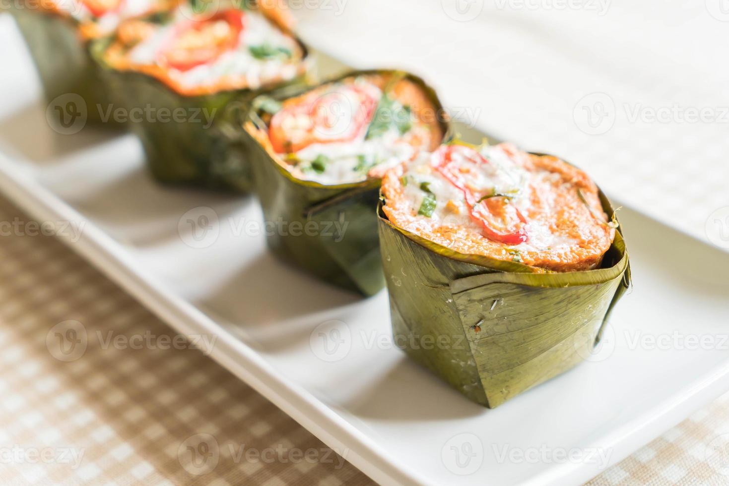 Thai steamed curried fish on the table photo