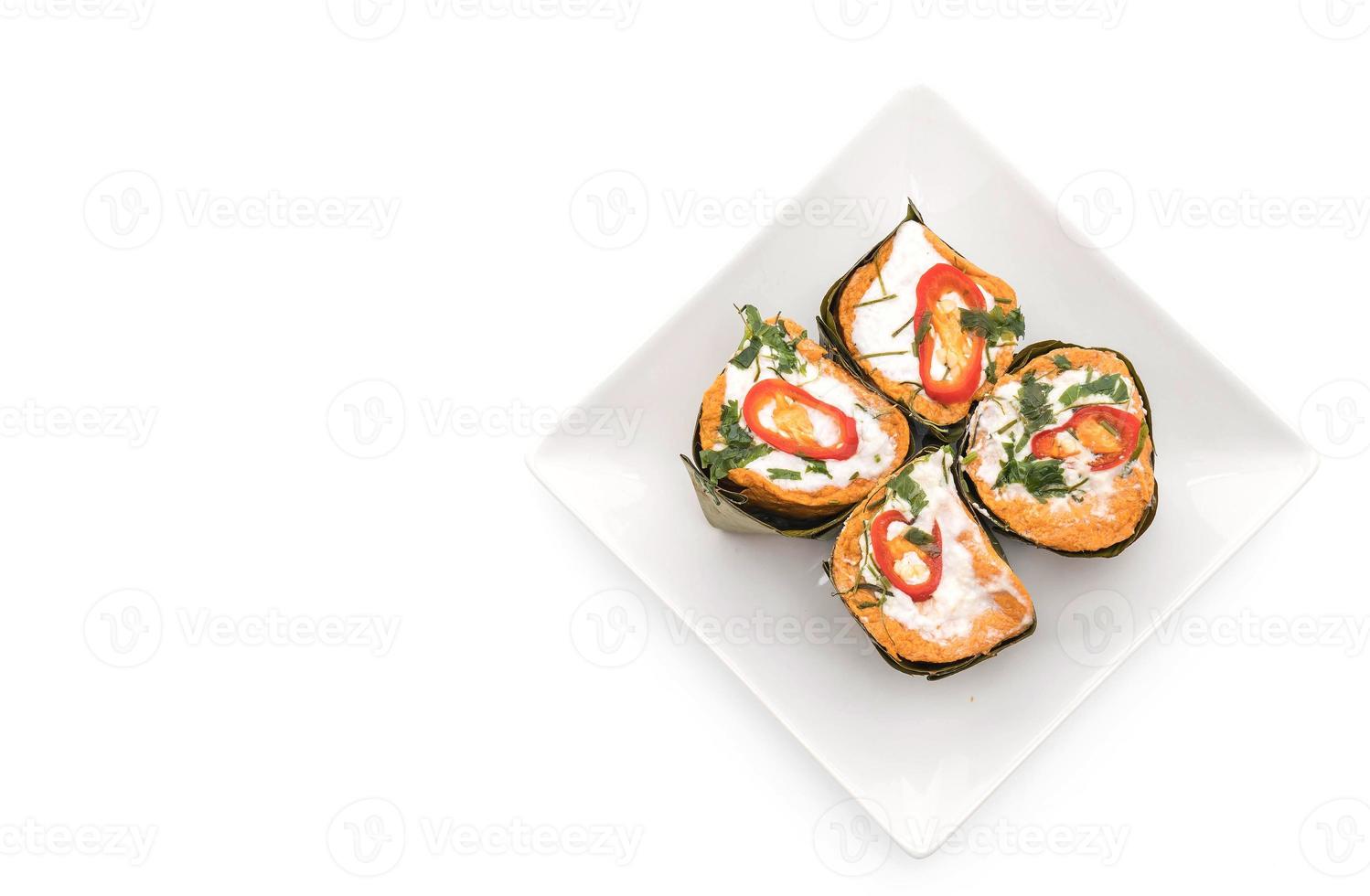 Thai steamed curried fish on white background photo