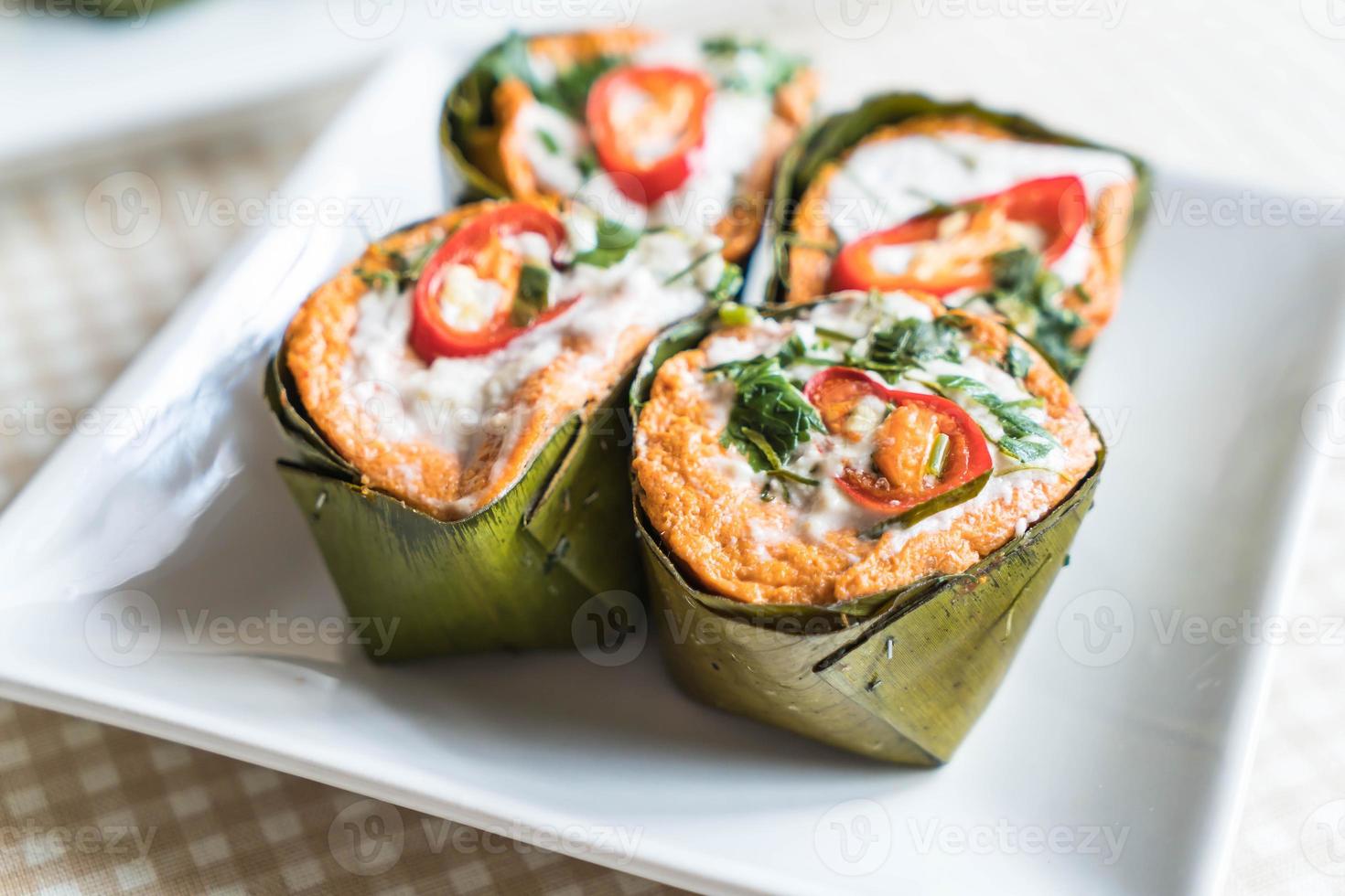 Thai steamed curried fish on the table photo