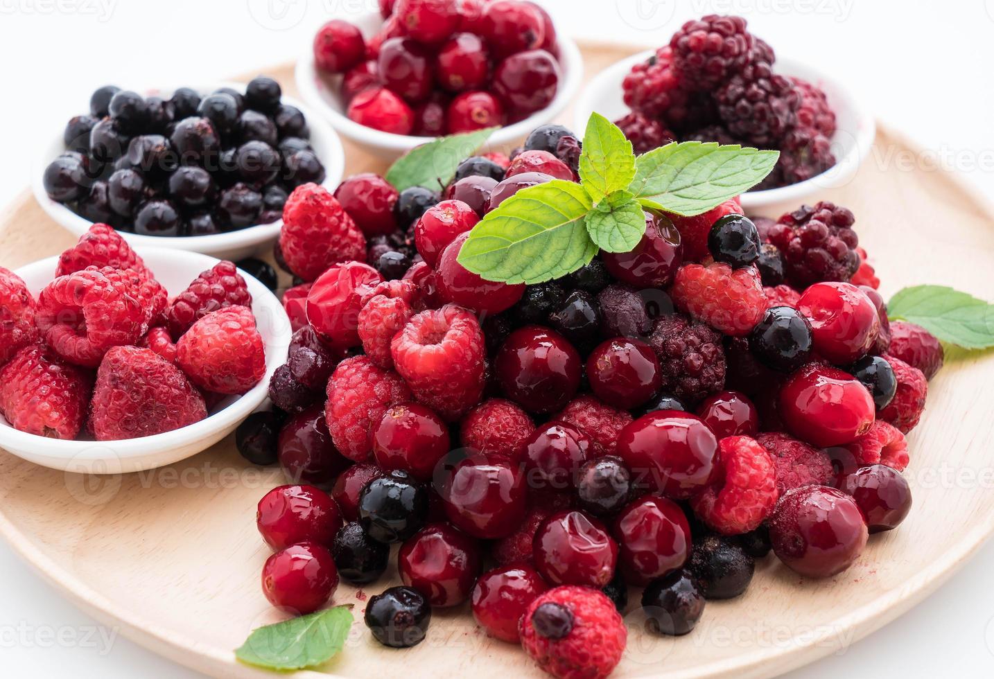 Frozen mixed berry on white background photo