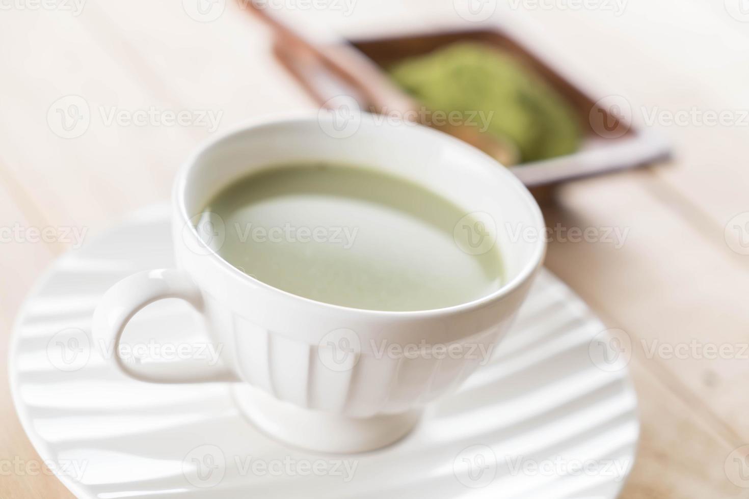 A cup of matcha latte green tea photo