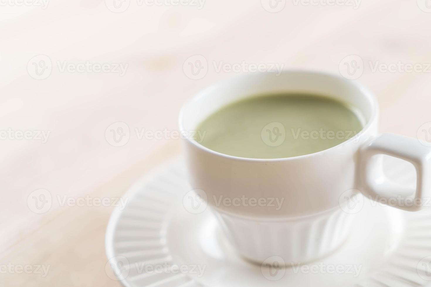 A cup of matcha latte green tea photo