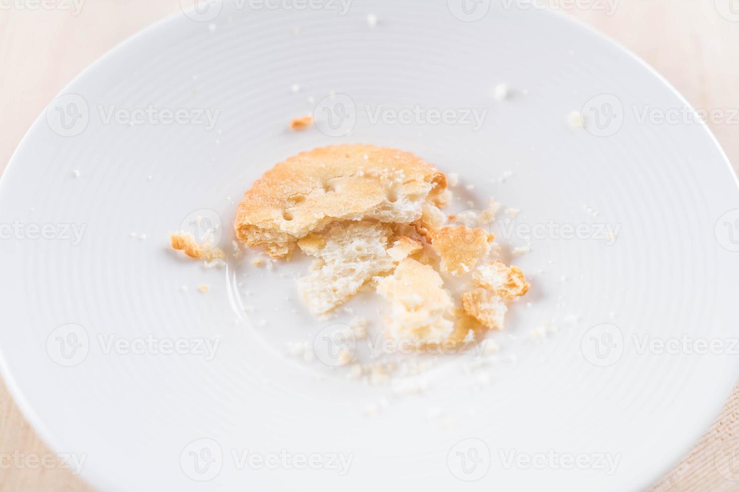 Crackers or biscuits on white plate photo