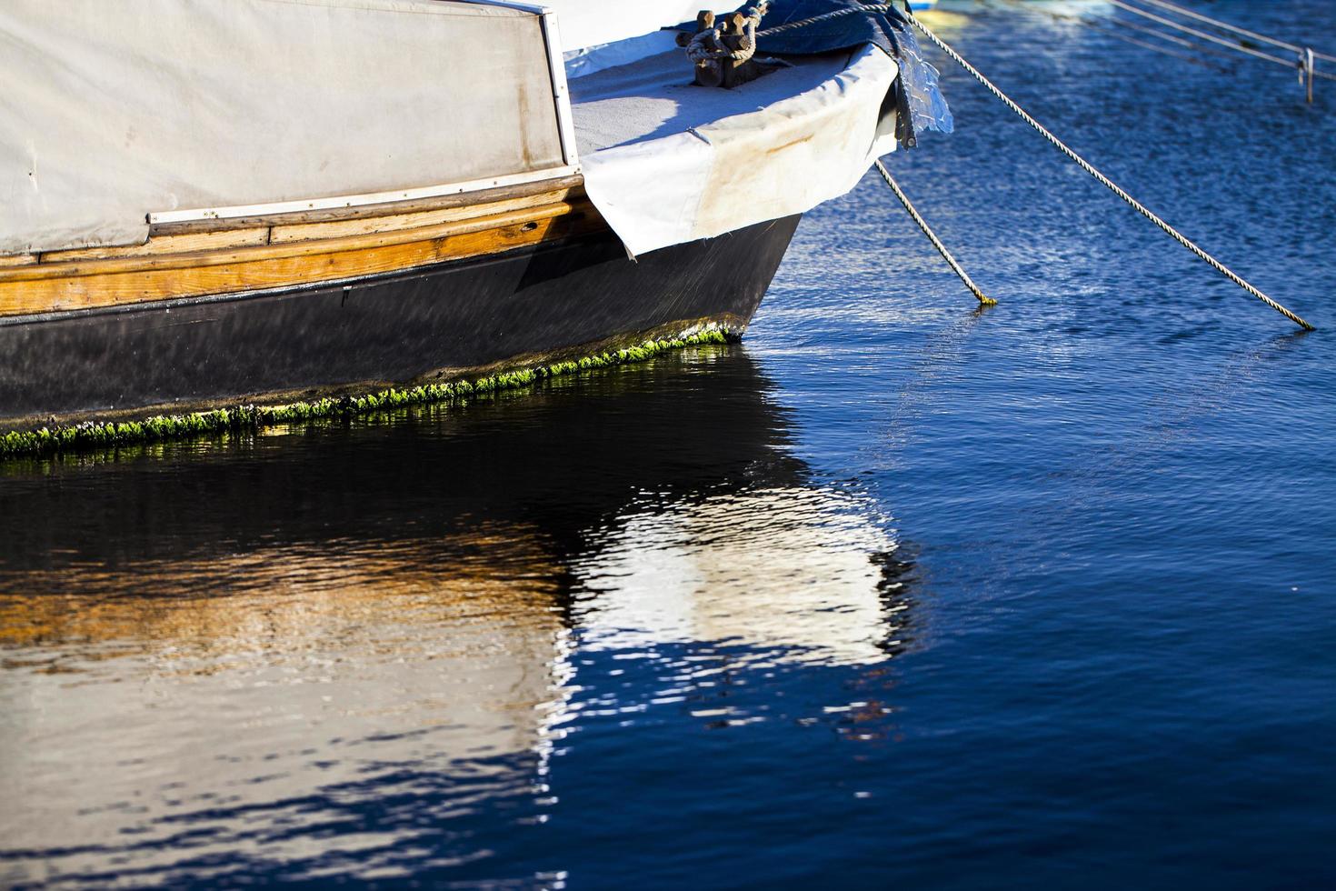 Boat Reflection on the Sea Water photo