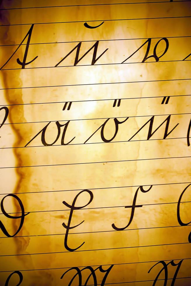 Vintage old Latin Alphabets on Paper Background photo