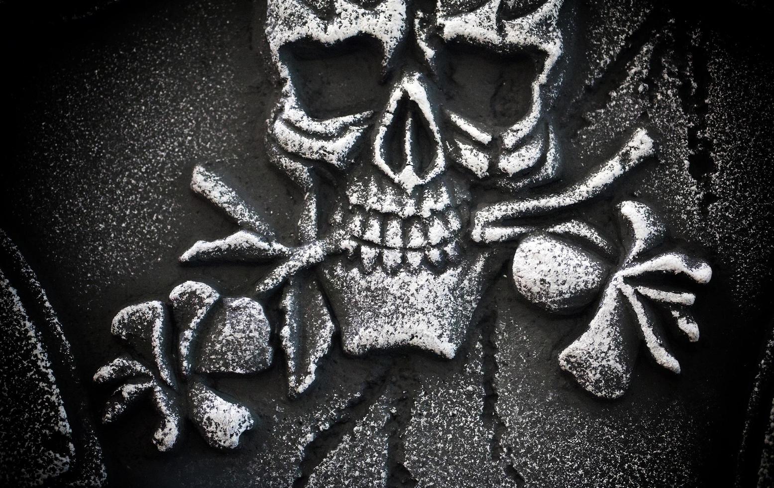 Scary Halloween Symbol Skull on Gravestone photo