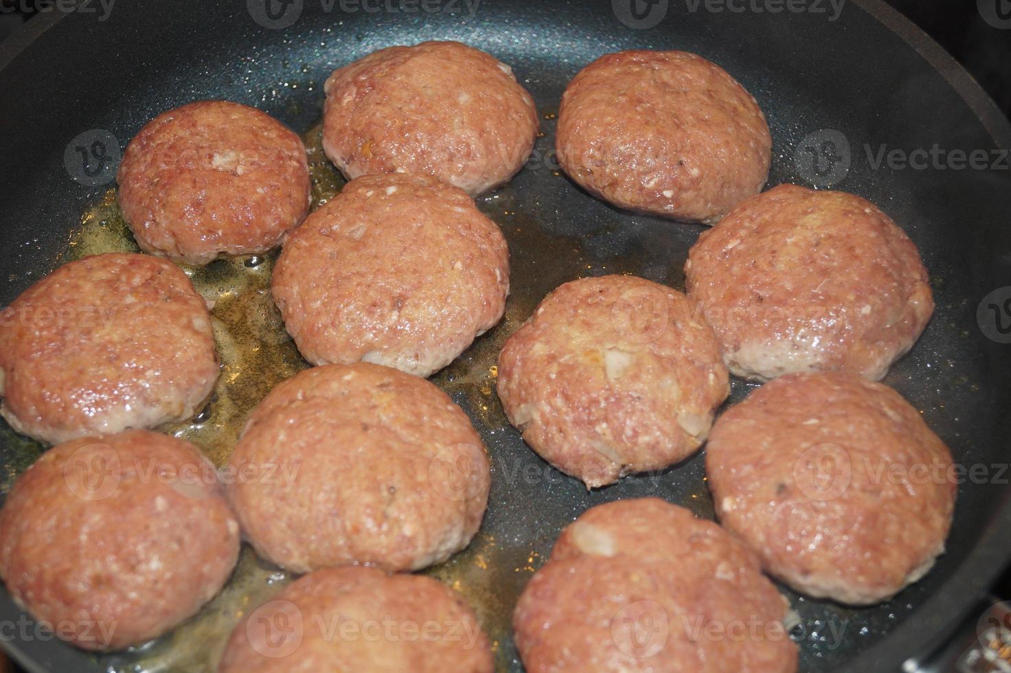 Fried meatballs with boiled broccoli and parsley potatoes photo