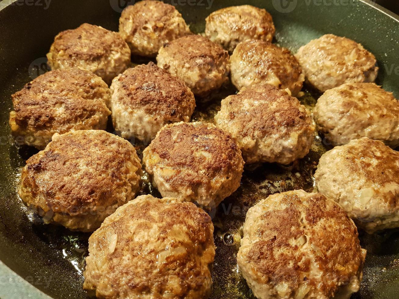 Fried meatballs with boiled broccoli and parsley potatoes photo