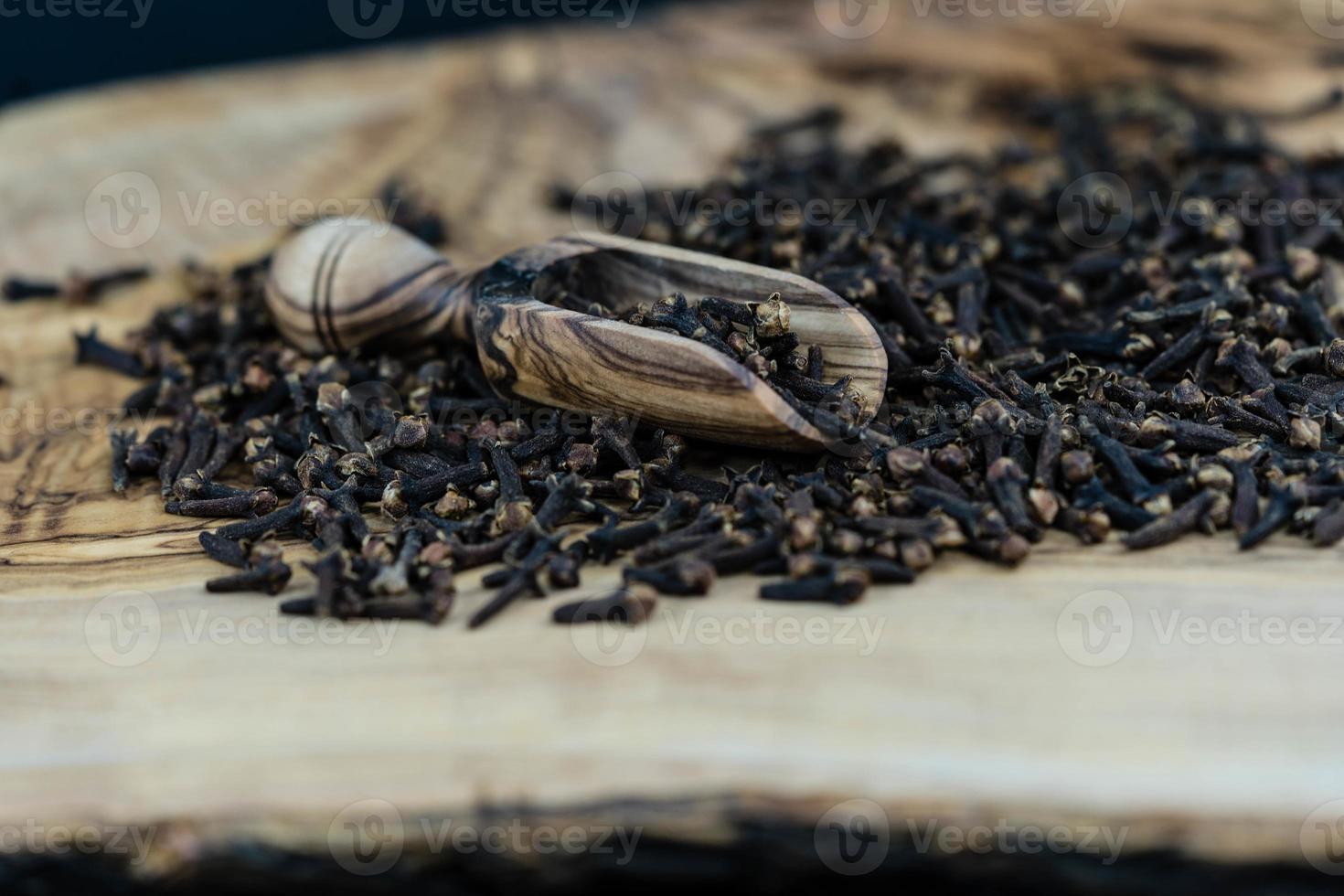 dried clove on olive wood photo