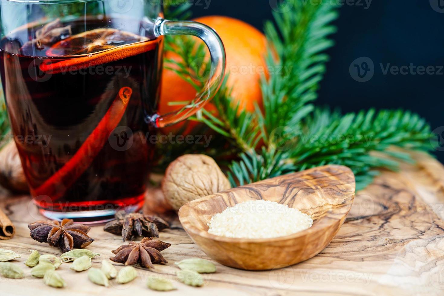 mulled wine and christmas spices on olive wood photo