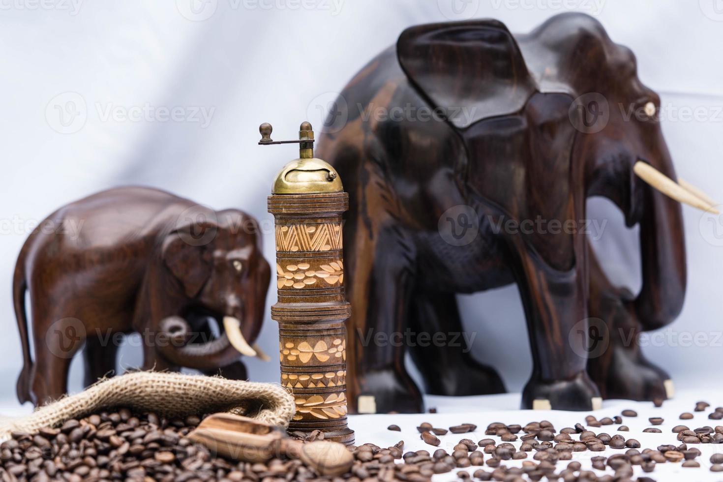 roasted Coffee beans and a vitage coffee grinder photo