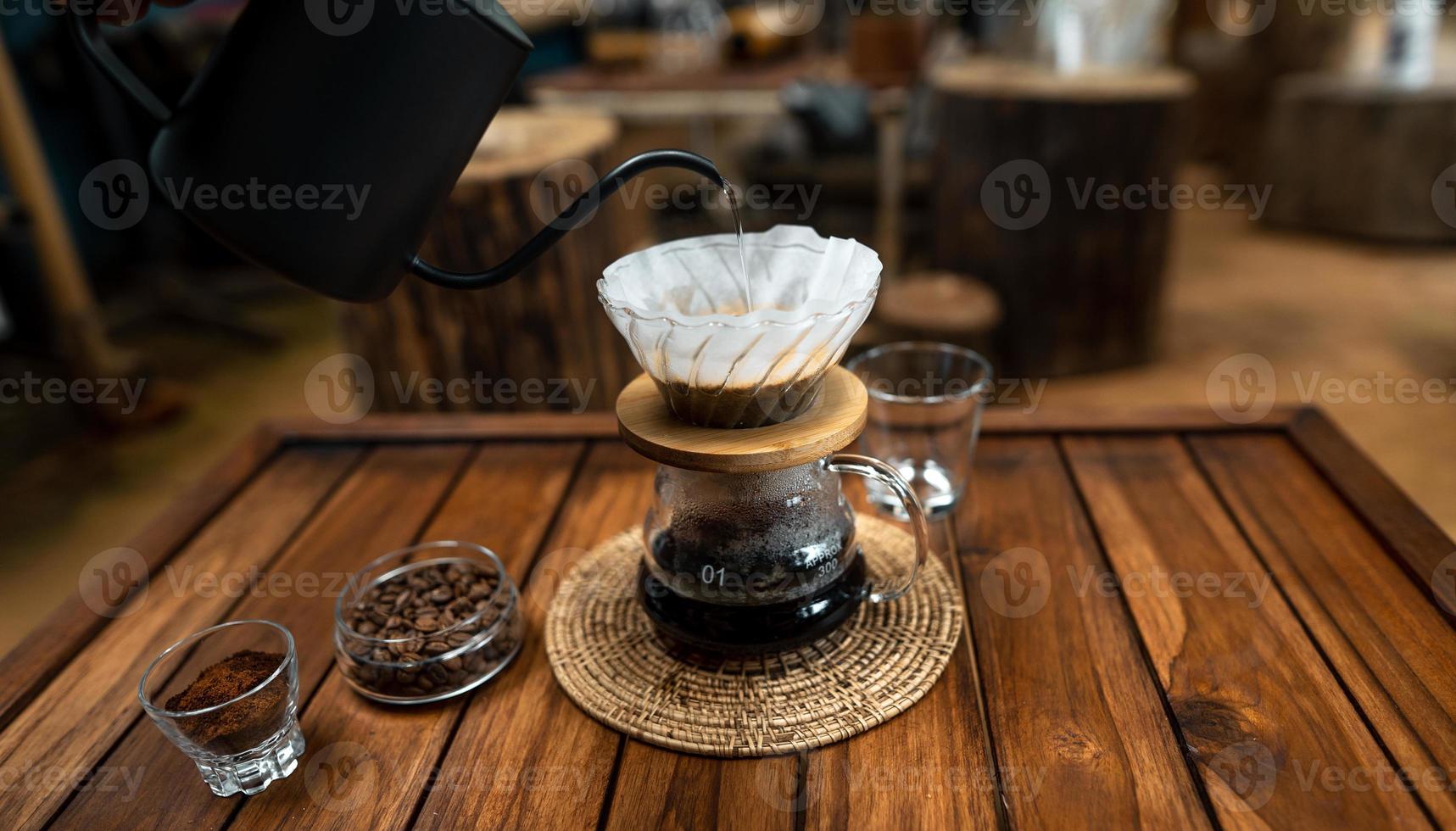 drip coffee on a wooden table at home photo