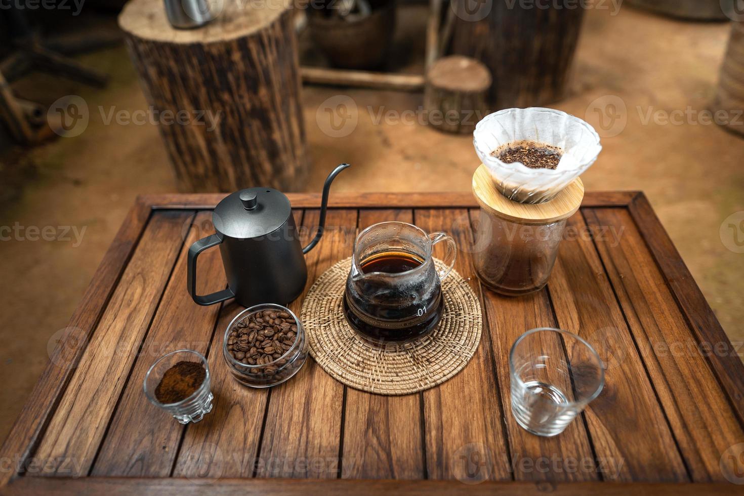drip coffee on a wooden table at home photo