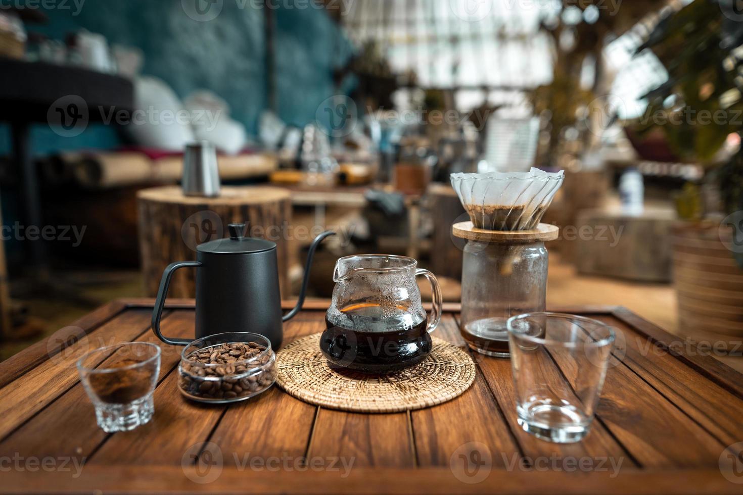 drip coffee on a wooden table at home photo