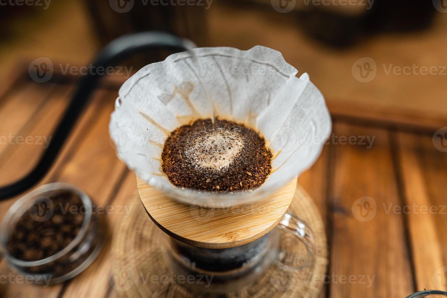 drip coffee on a wooden table at home photo