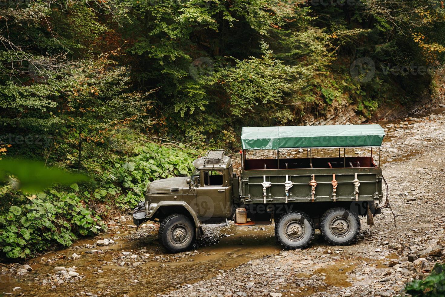 Soviet truck in the Carpathian Mountains carries people on excursions. photo