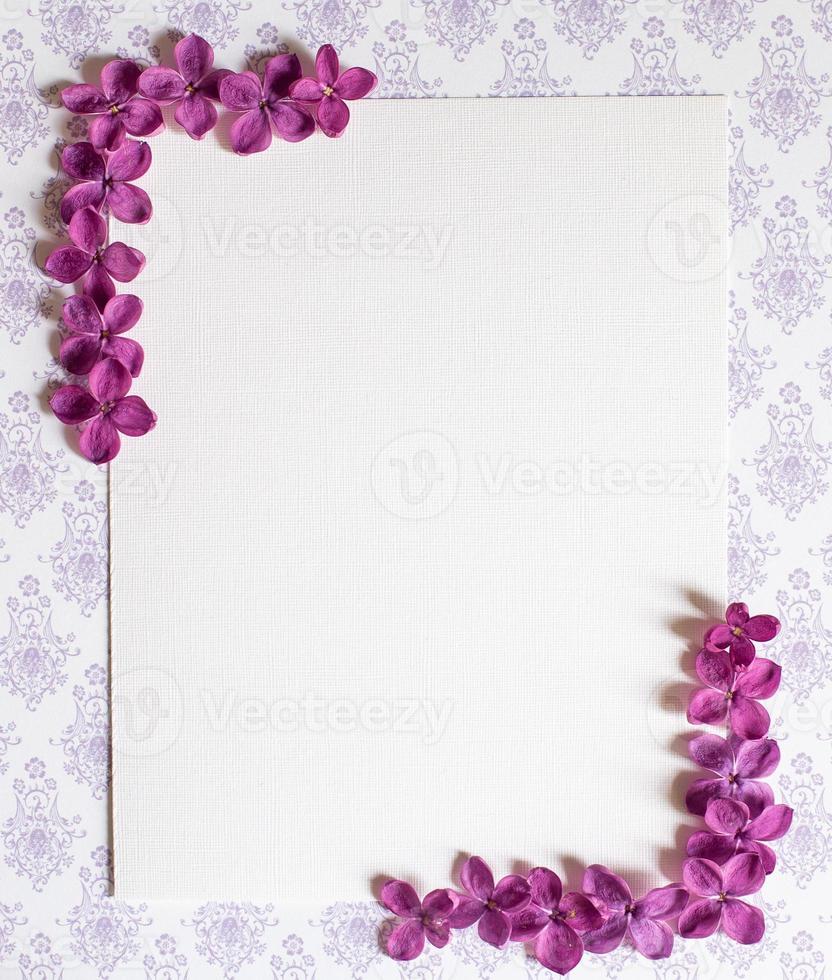 Background with copy space blank on table with lilac purple flower. photo