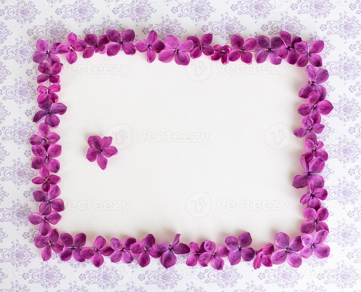 Background with copy space blank on table with lilac purple flower. photo