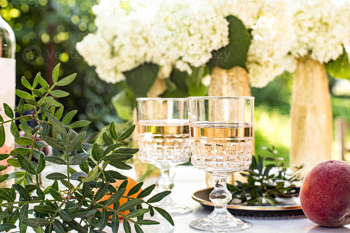 Rose wine in glasses. Rose wine on golden bottles background 3103584