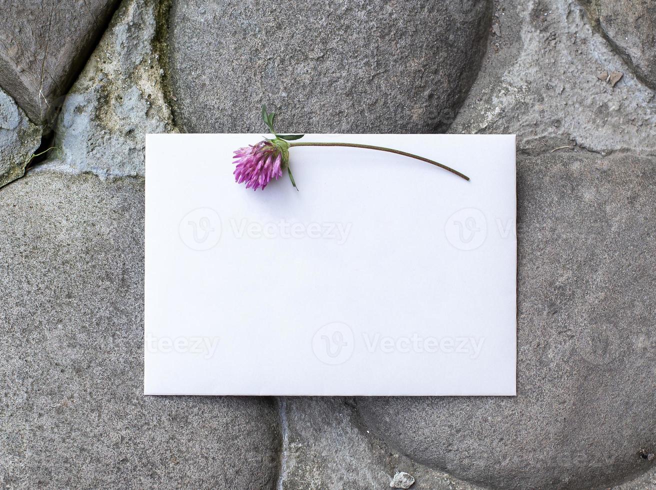 Wedding details flat lay on stone background. Wedding invitation. photo