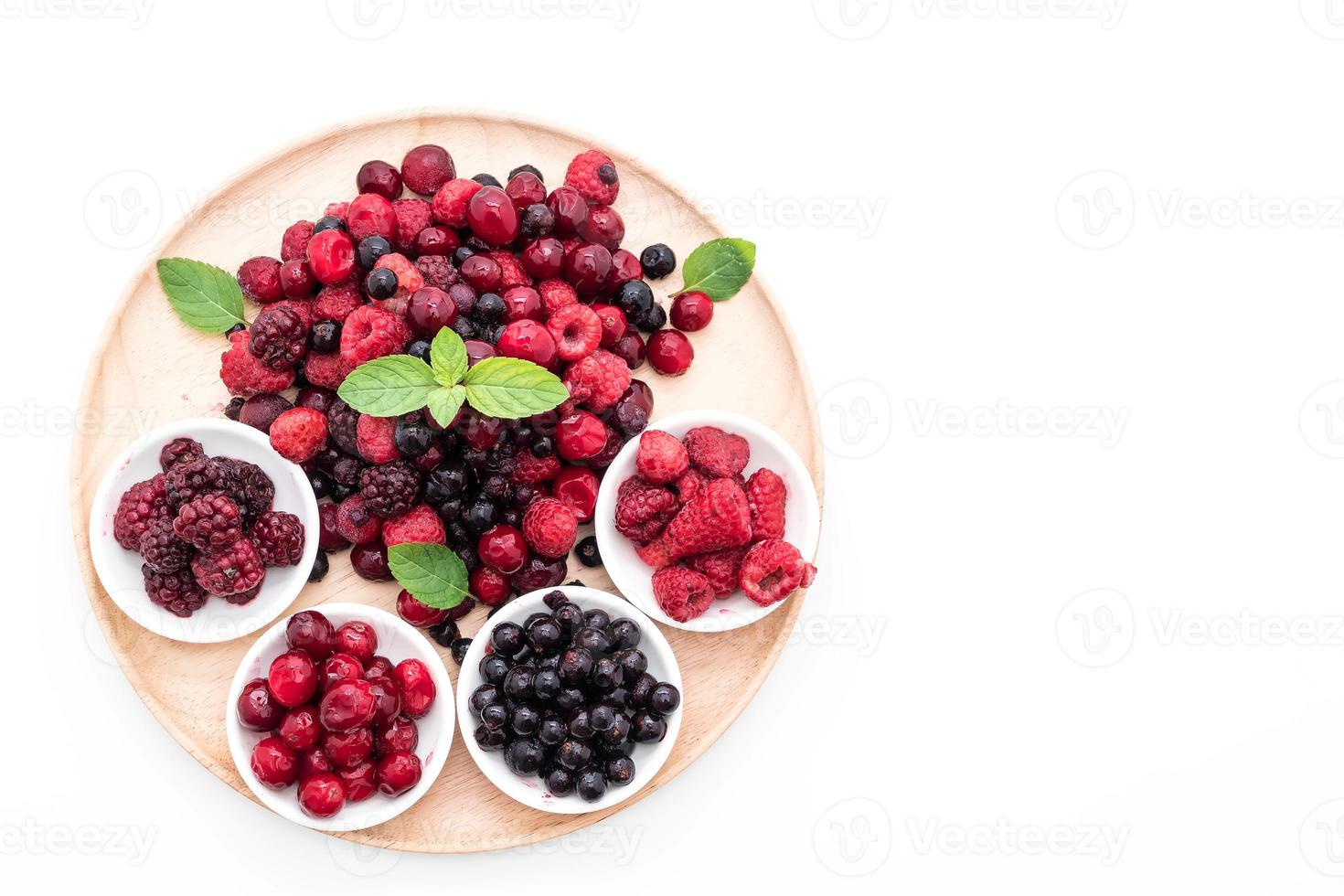 Frozen mixed berry on white background photo