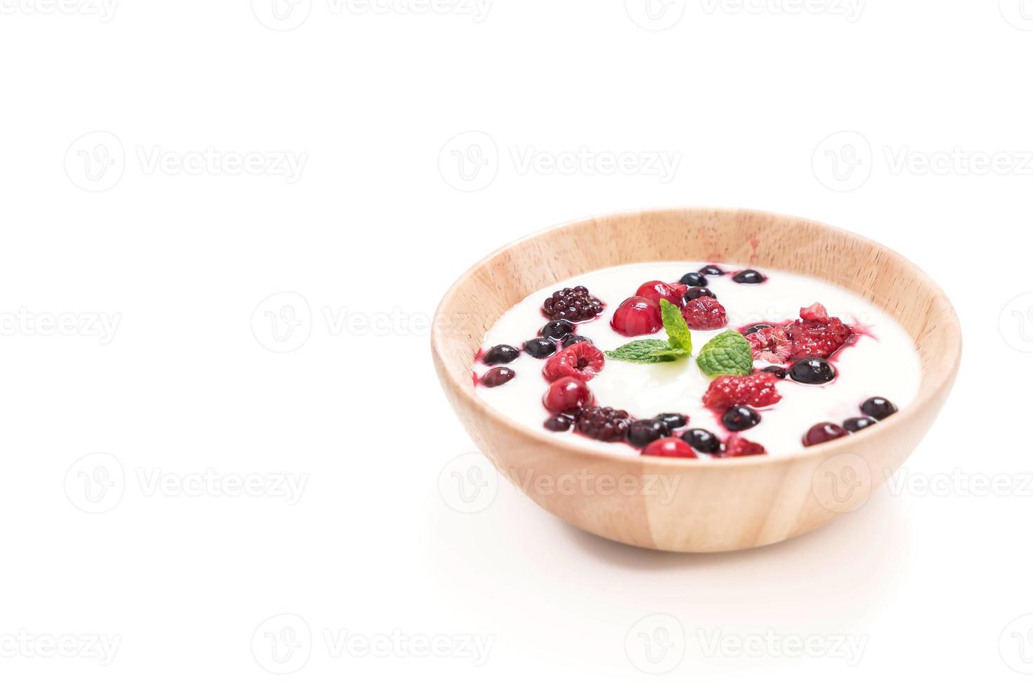 Yogurt with mixed berries on white background photo