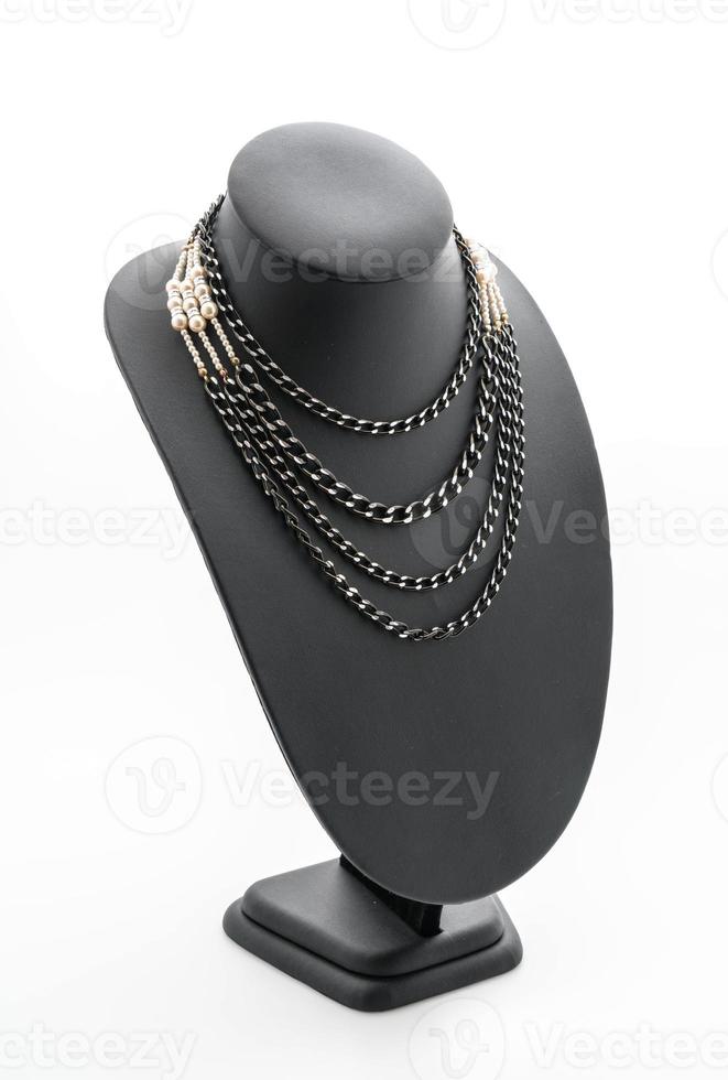 Beautiful and luxury necklace with jewelry stand neck on white photo